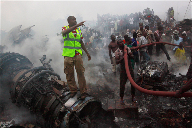 firefighters at the Dana Air crash site 